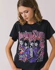 Front view of woman wearing Chaser’s The Rolling Stones The British Are Coming Tee in True Black with Union Jack, band logo, and band member graphics on a plain background