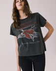 Front view of woman wearing Chaser’s Tom Petty Live At The Fillmore Tee with vintage concert graphic on a plain background