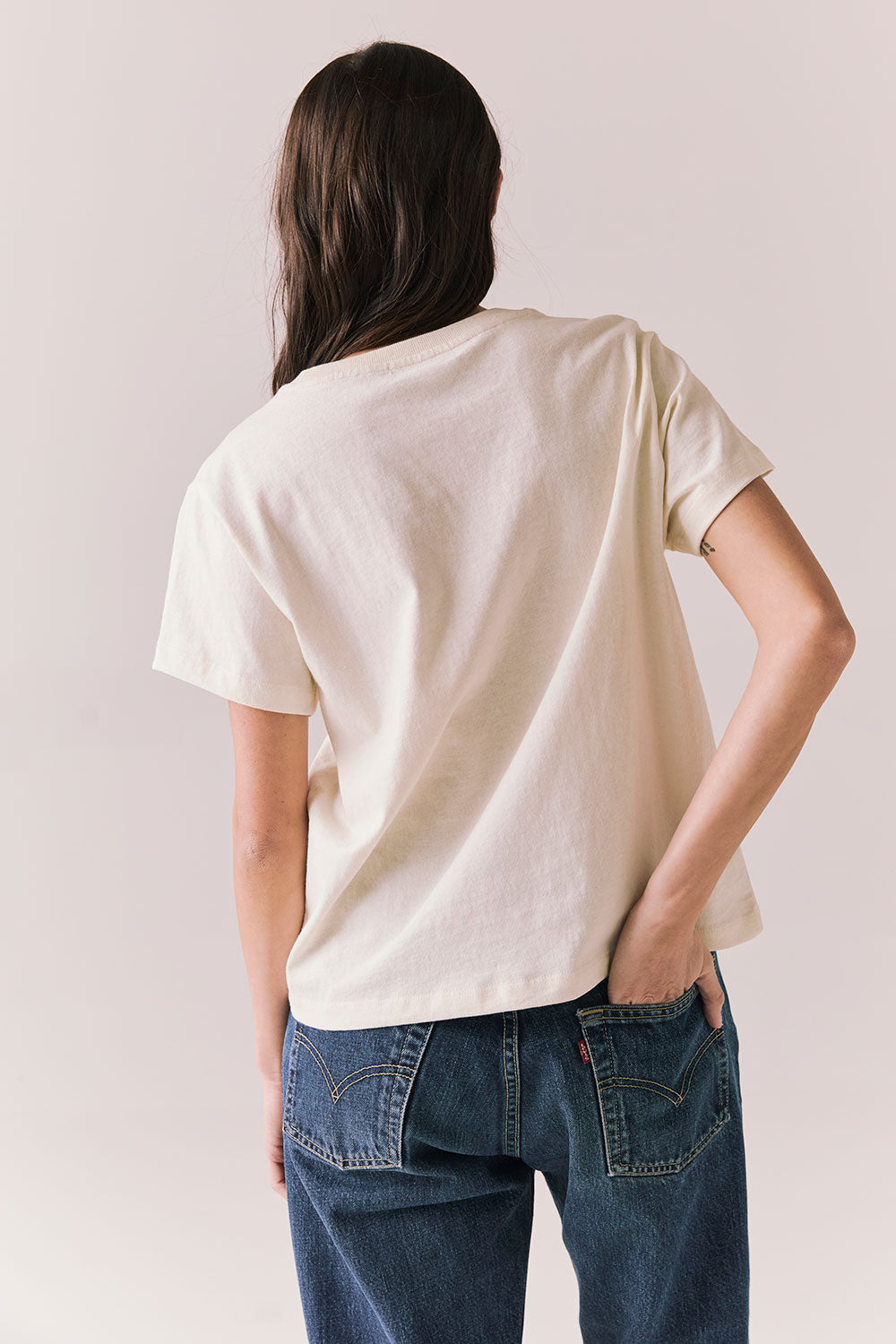 Back view of Rambler Starry White Tee with ringer neck and cap sleeves on a plain background