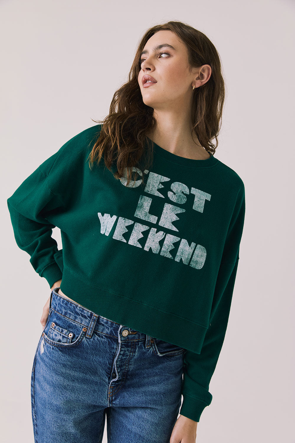 Front view of woman wearing Chaser’s Blue Grass Green C’est Le Weekend Long Sleeve with text on a plain background