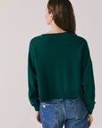  Back view of woman wearing Chaser’s Blue Grass Green C’est Le Weekend Long Sleeve on a plain background