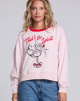 Model wearing Chaser's Champagne Party Pullover in Pinky pink with festive champagne glass artwork, front view