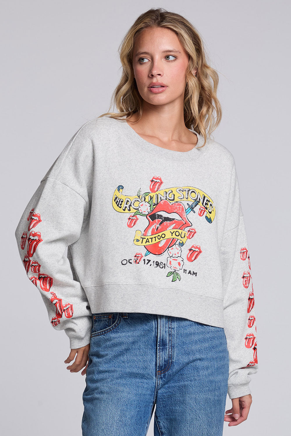 Model wearing Chaser's Rolling Stones Tattoo You Pullover in Heather Grey with colorful Rolling Stones Tattoo You artwork and red sleeve graphics, front view