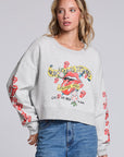 Model wearing Chaser's Rolling Stones Tattoo You Pullover in Heather Grey with colorful Rolling Stones Tattoo You artwork and red sleeve graphics, front view