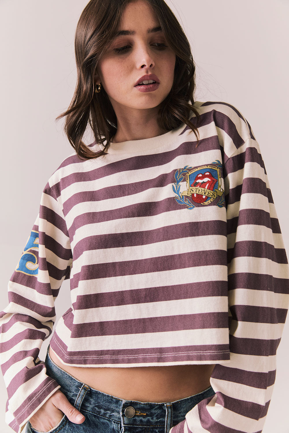 Front view of The Rolling Stones Rugby Stones Logo Long Sleeve with red and white stripes, cropped fit, and tongue logo graphic against a plain background