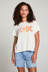 Front view of model in AC/DC 1979 Tour Gradient Tee styled with denim shorts for a retro festival look against a plain background