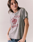 Side view of model wearing Wildcat Spirit Tee in Heather Grey with maroon wildcat chest graphic against a plain background