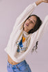 Relaxed stretch pose in Chaser Brand Montauk Vintage White Pullover showing soft drape and cropped fit