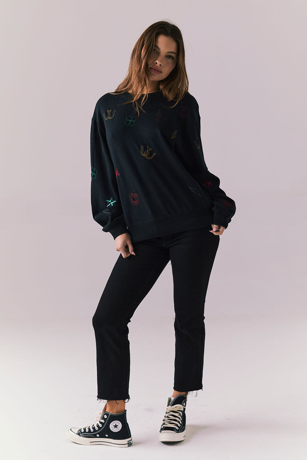 Full body view of model in Allover Icons Long Sleeve in black