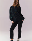 Full body view of model in Allover Icons Long Sleeve in black