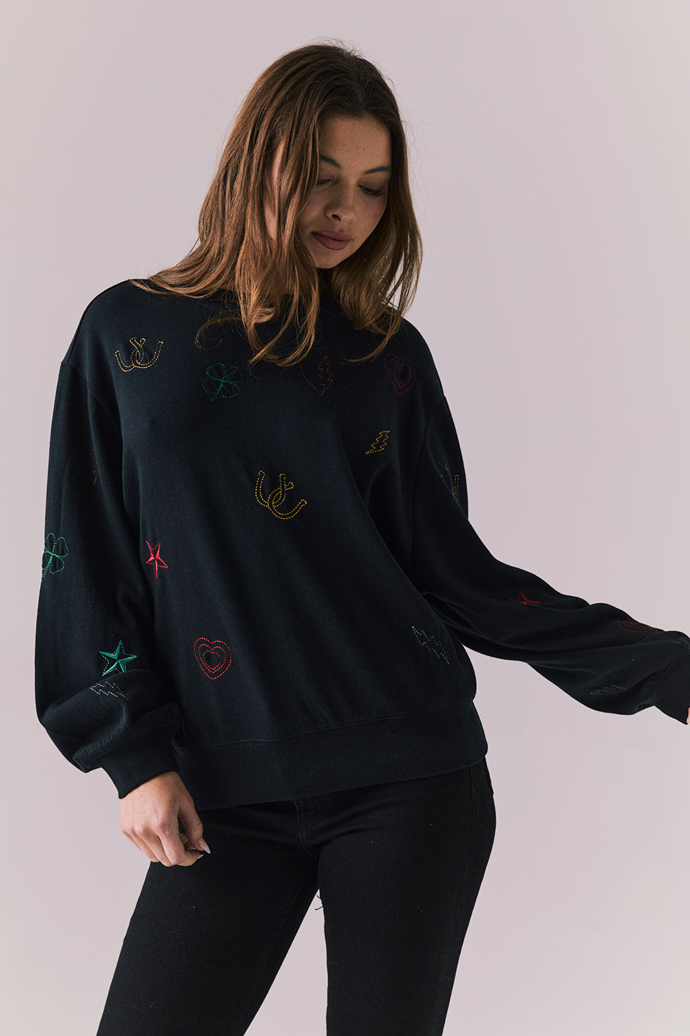Front view of model wearing Allover Icons Long Sleeve in black