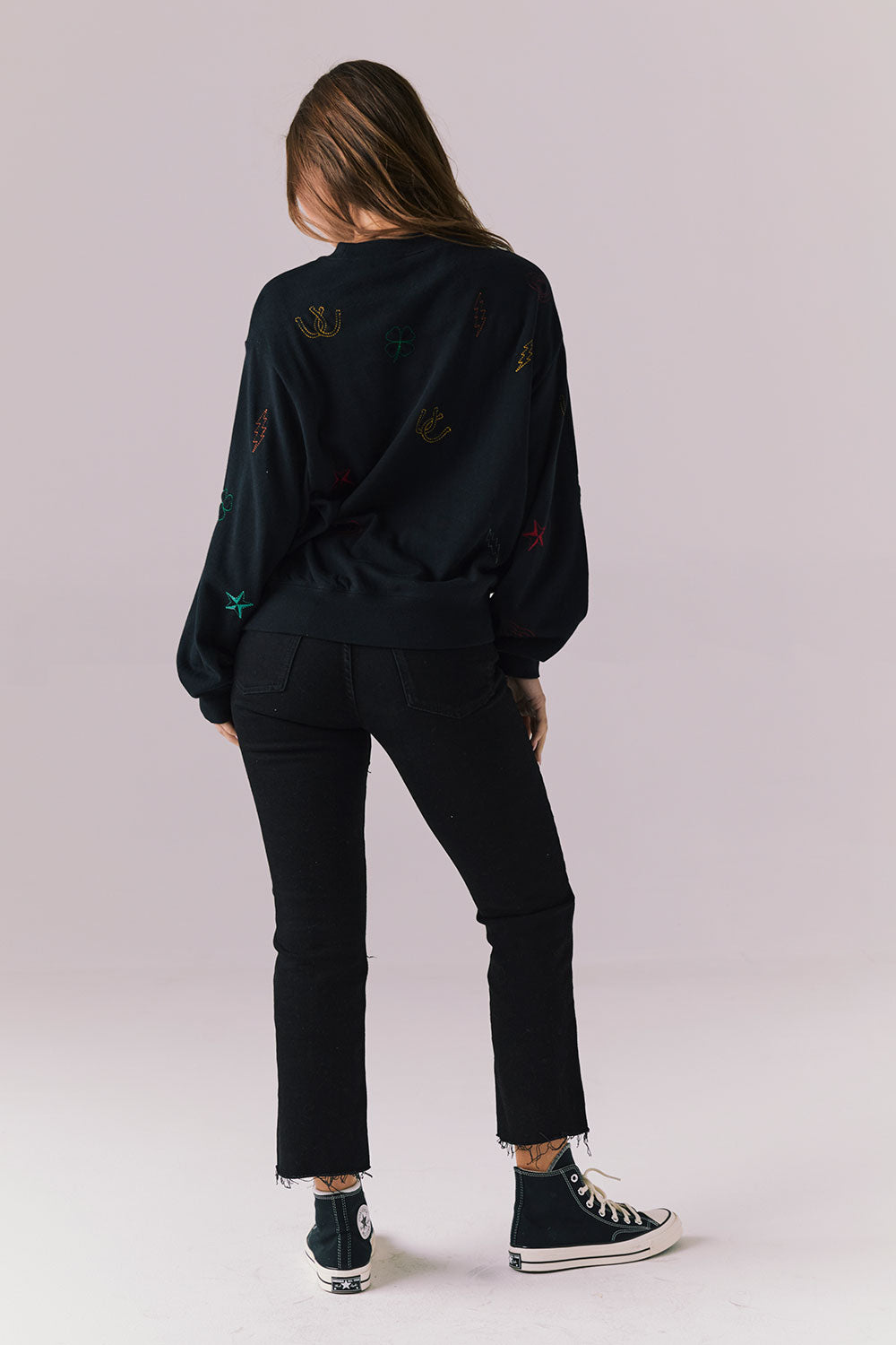 Back full body view of model in Allover Icons Long Sleeve in black