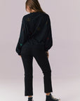 Back full body view of model in Allover Icons Long Sleeve in black