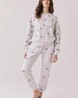 Full body view of woman wearing Chaser’s light grey Tossed Hearts Long Sleeve with matching Tossed Hearts Joggers on a white background
