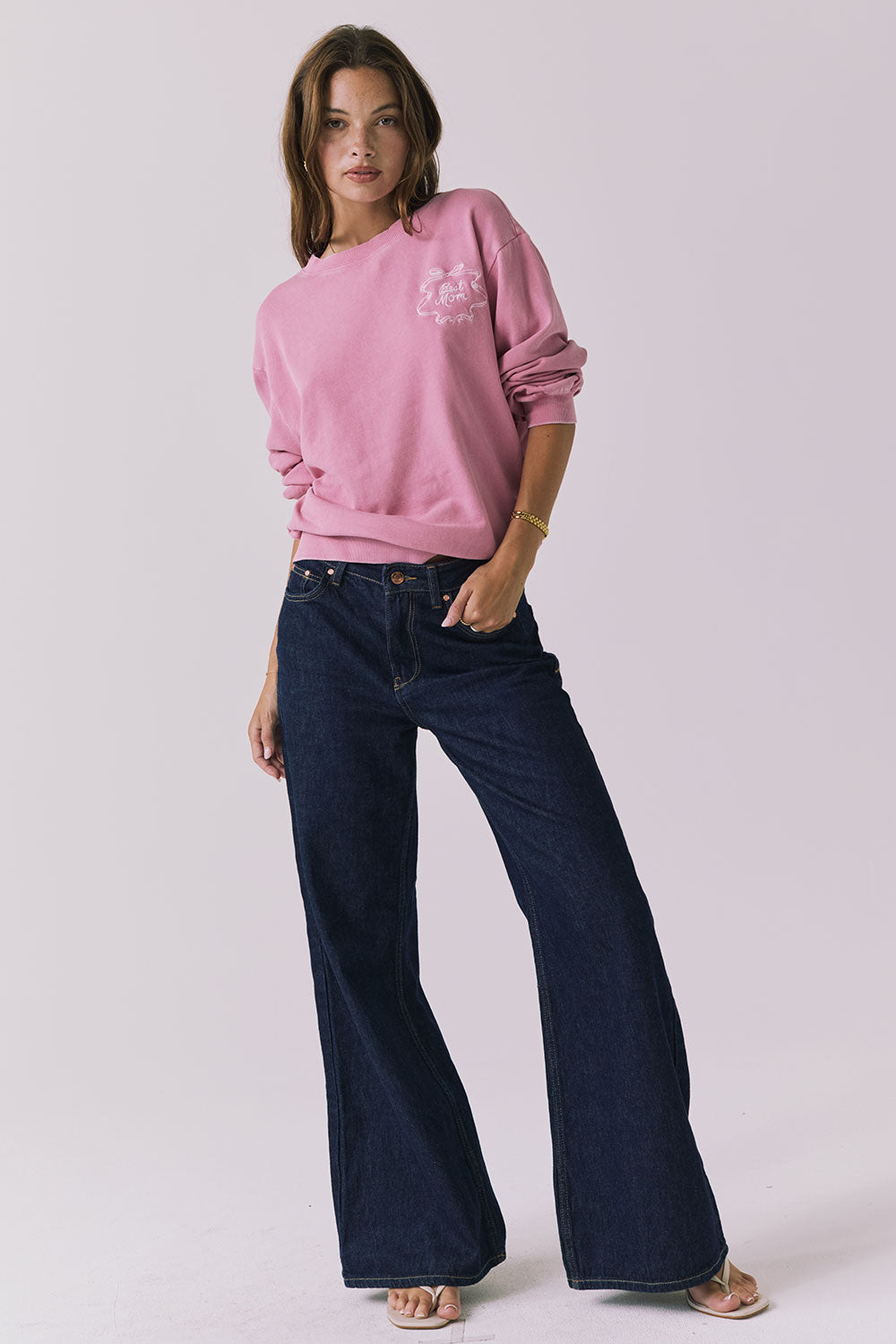Full body view of the Chaser Best Mom Long Sleeve styled casually with dark denim