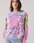 Front view of woman wearing Chaser’s Grateful Dead Rose Logo Long Sleeve with tie-dye pattern on a plain background