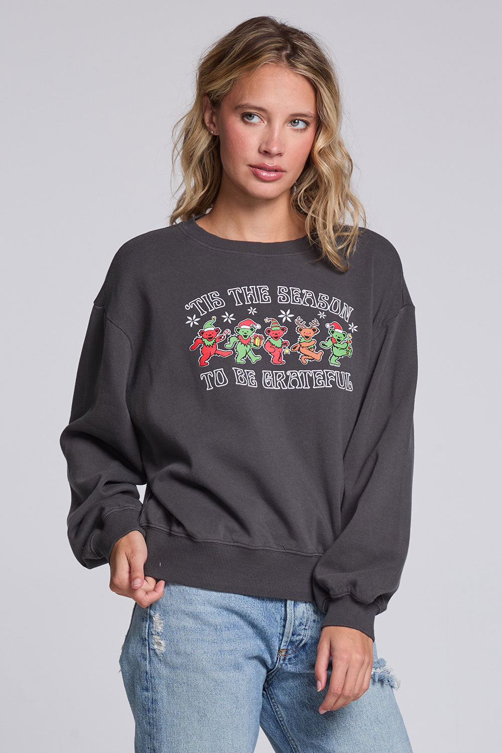 Model wearing Chaser's Grateful Dead 'Tis the Season Pullover in Fresh Gravel with colorful Grateful Dead holiday artwork, angled view