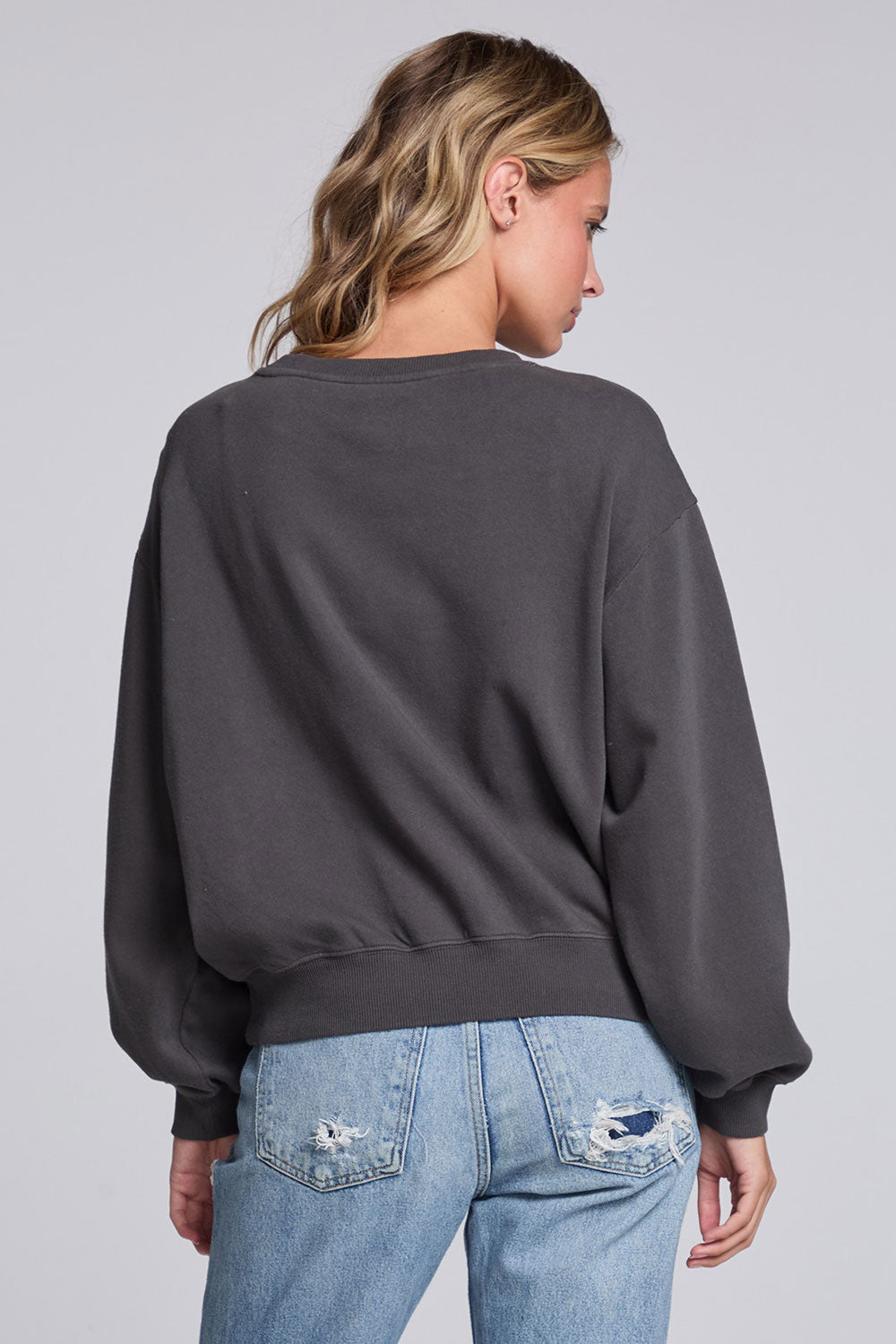 Model wearing Chaser's Grateful Dead 'Tis the Season Pullover in Fresh Gravel with colorful Grateful Dead holiday artwork, back view