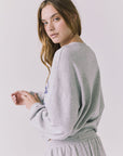 Side angle of the Chaser Ain’t My First Rodeo Heather Grey Long Sleeve showing relaxed fit