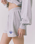 Chaser Ain’t My First Shorts in Heather Grey with close up of blue horseshoe rope graphic at hem