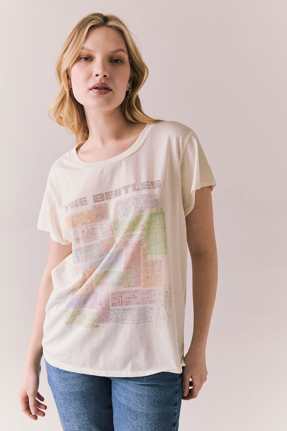Front view of The Beatles Ticket Stub Collage Tee in Starry White with vintage ticket graphic and classic band logo against a plain background