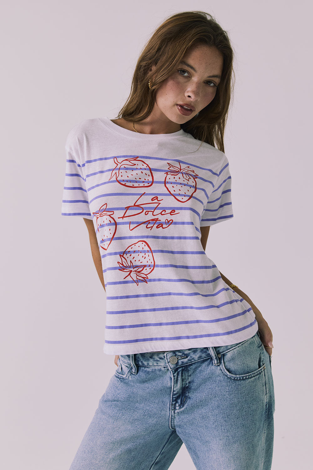 Chaser La Dolce Vita Tee featuring a strawberry graphic with Italian slogan text on a striped white tee