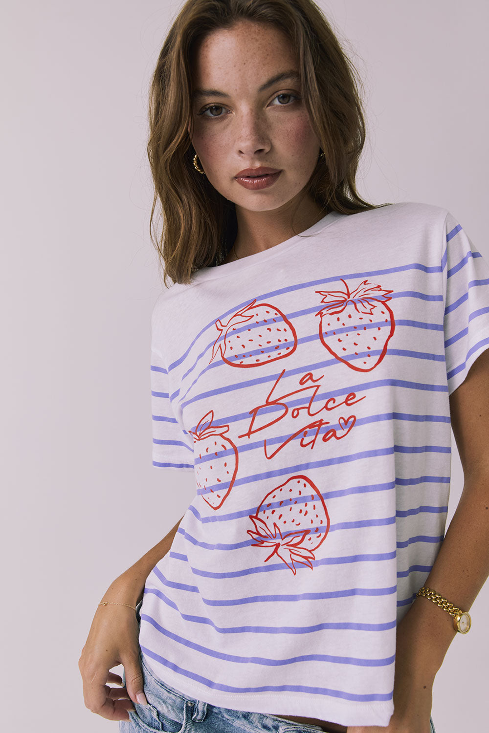 Close up view of the Chaser La Dolce Vita Tee highlighting the strawberry illustration and Italian graphic text