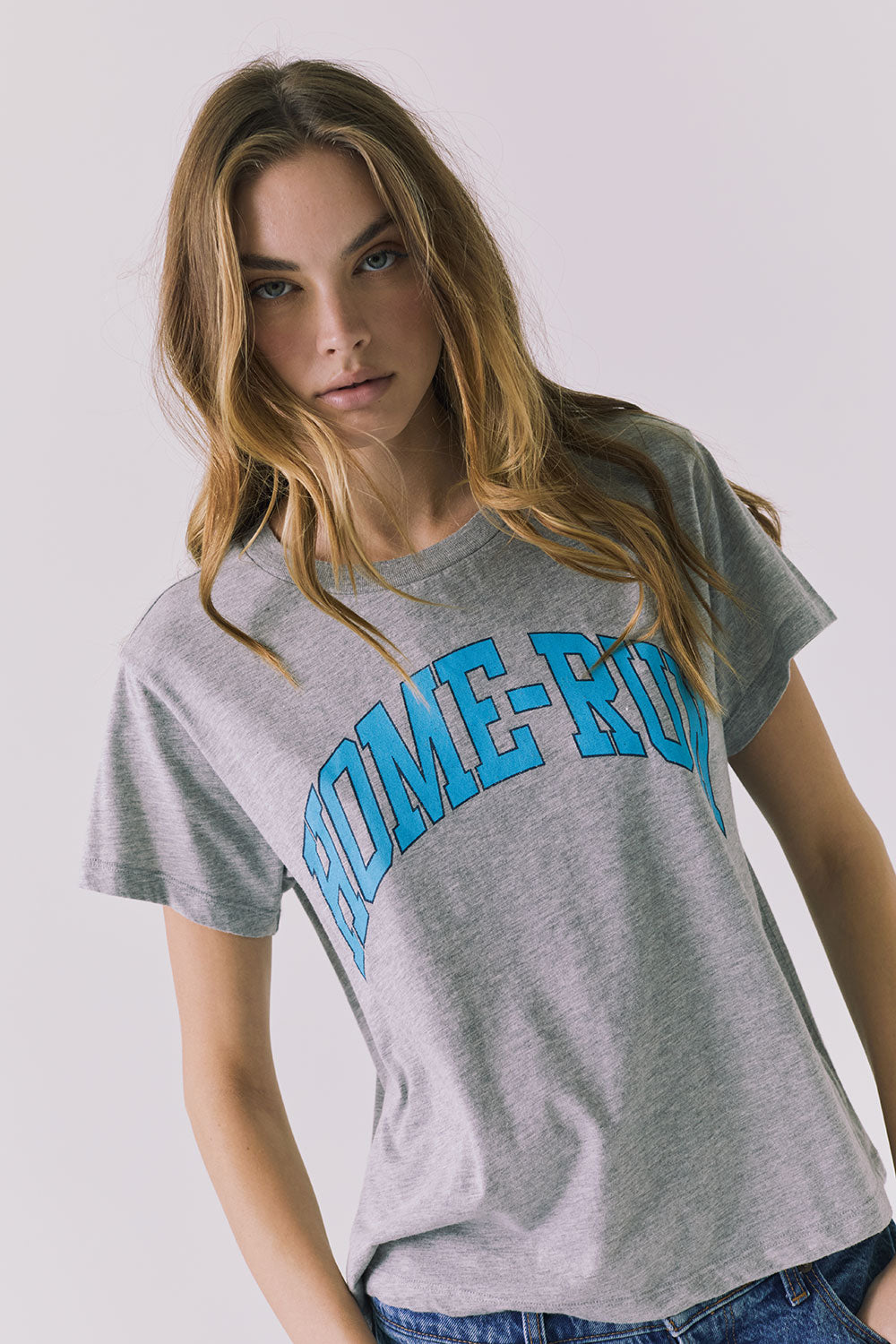 Angled front view of the Chaser Home Run Tee in Heather Grey emphasizing the relaxed shape and bold graphic placement