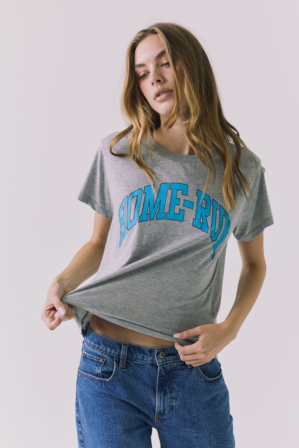 Three quarter front view of the Chaser Home Run Tee in Heather Grey showing the easy fit and vintage athletic graphic styling