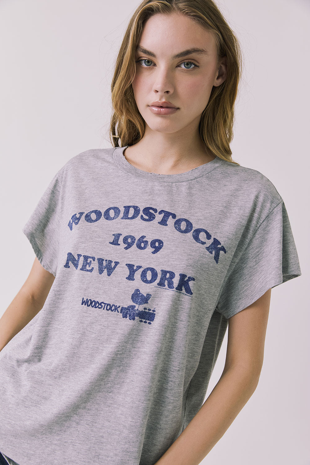 Close up view of the Chaser Woodstock 1969 New York Tee highlighting the licensed band collaboration print and heathered fabric texture