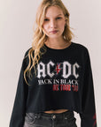 Front view of AC/DC UK Tour ’80 Tee in True Black with vintage UK Tour 1980 poster graphic and cropped long-sleeve fit on plain background