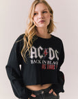 Front view of AC/DC UK Tour ’80 Tee in True Black with vintage UK Tour 1980 poster graphic and cropped long-sleeve fit on plain background