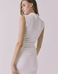 Back view of the Chaser Hailey White Top showing a streamlined sleeveless cut and smooth fabric drape through the waist