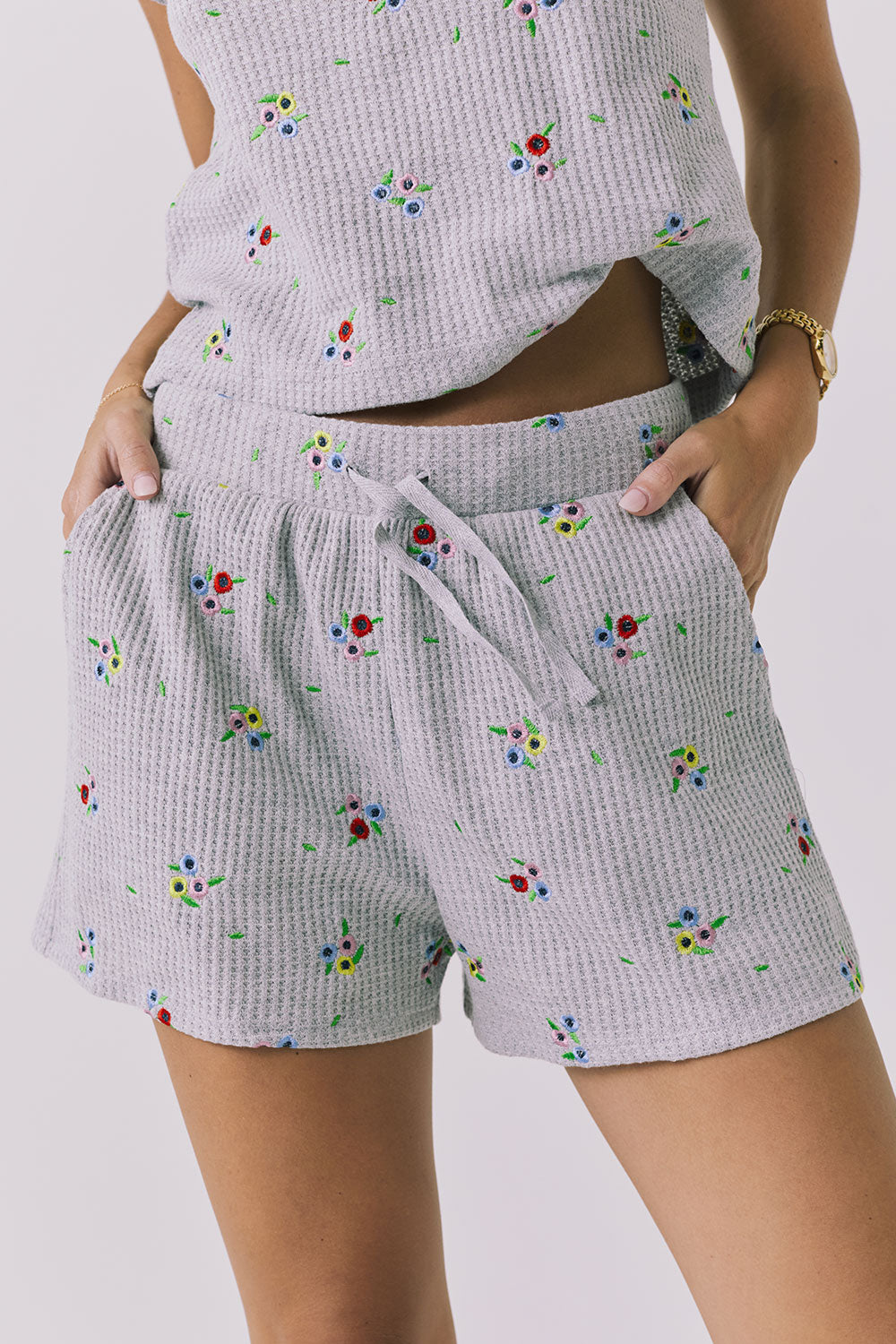 Chaser Kesh Short in Heather Grey with ditsy embroidery shown from the front featuring a waffle knit texture elastic waistband and adjustable drawstring