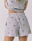 Chaser Kesh Short in Heather Grey with ditsy embroidery shown from the back featuring a relaxed silhouette elastic waistband and allover embroidered floral pattern