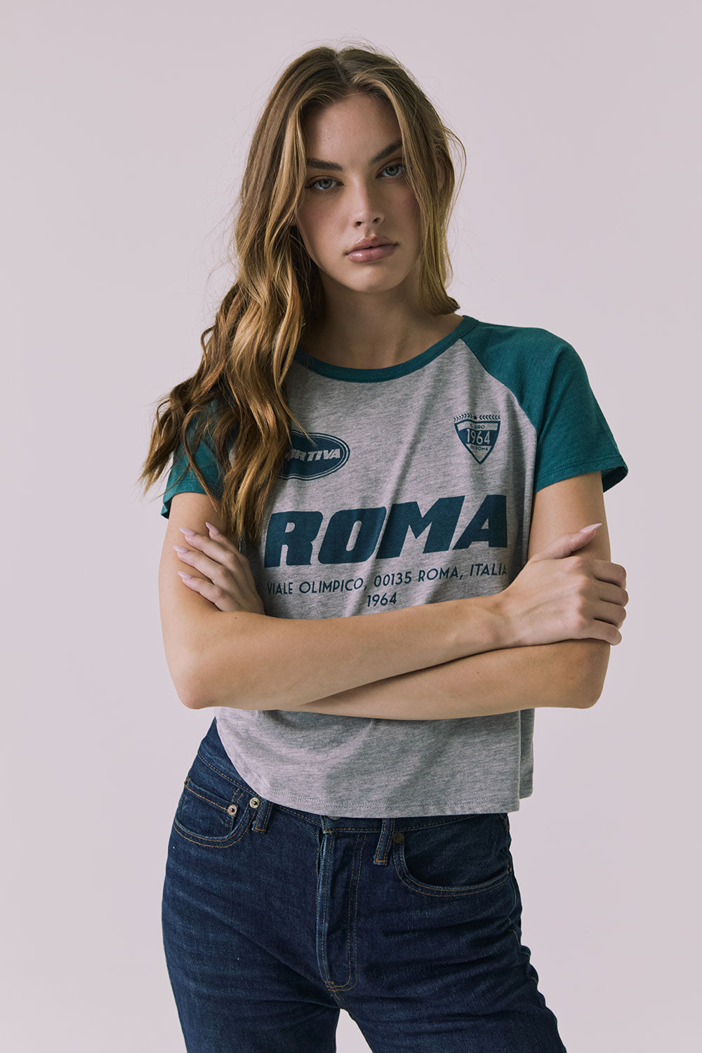 Front view of the Chaser Sportiva Heather Grey Tee featuring an Italian Roma graphic and teal raglan sleeves