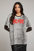 Front view of model wearing AC/DC Animal Print Logo Tee with red band logo and leopard print design against a plain background