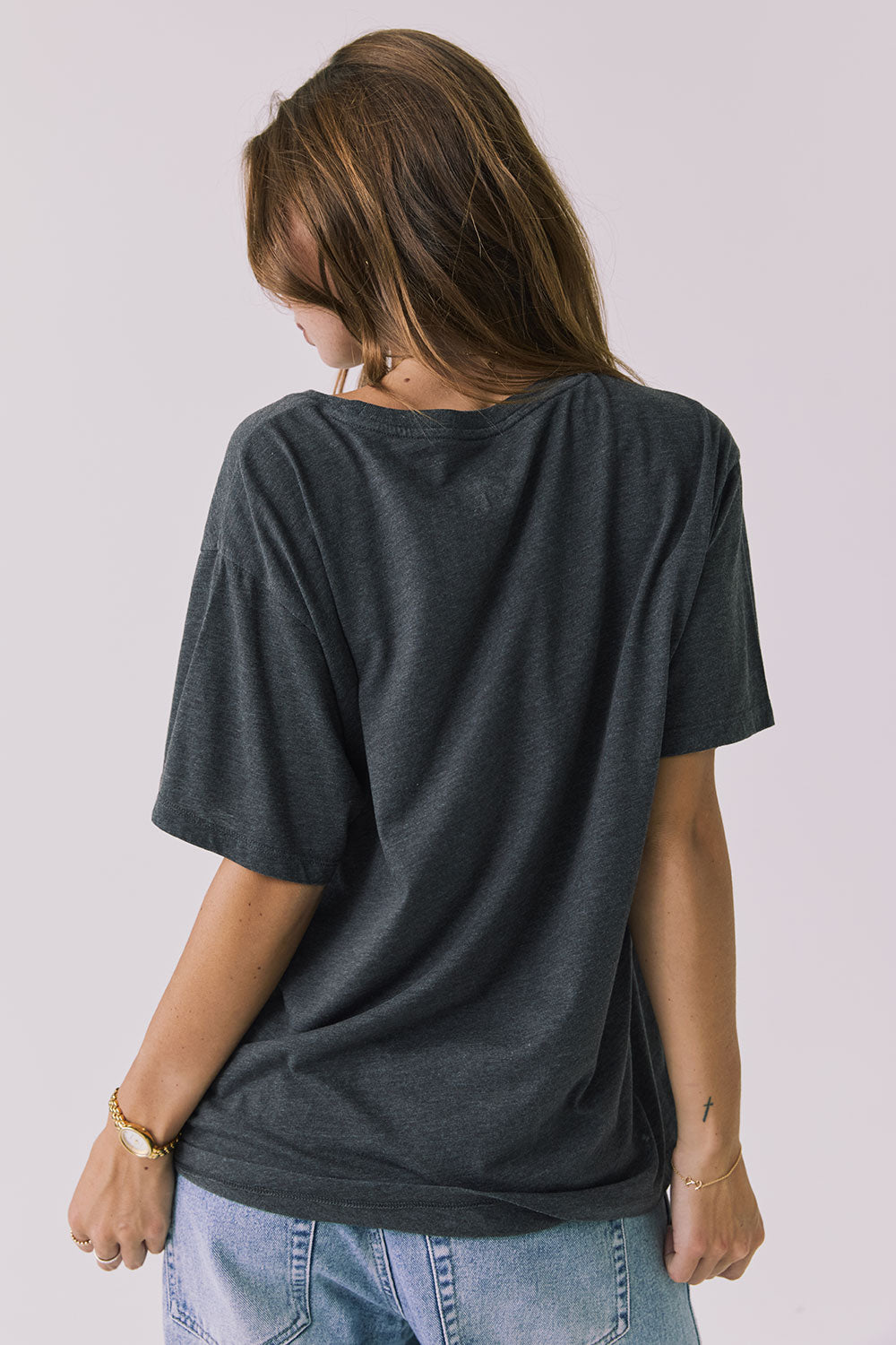 Back view of the Chaser Willie Nelson On The Road Again Tee in Vintage Black showing a clean solid back with relaxed drape