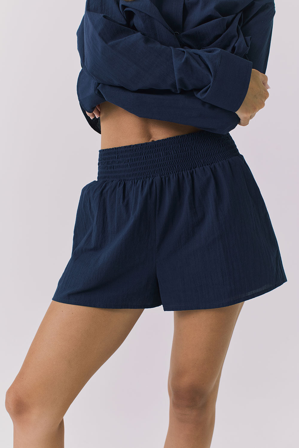 Chaser Durango Navy Shorts shown from the front with a relaxed fit elastic waistband and lightweight drape that hits mid thigh