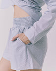 Side view of Chaser Durango Pinstripe Shorts highlighting the easy drape elastic waist and soft pinstripe fabric