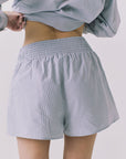 Back view of Chaser Durango Pinstripe Shorts showing the smocked waistband and flowy fit through the leg