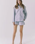 Full body view of Chaser Durango Pinstripe Shorts styled with the matching Paso Button Up creating an effortless coordinated set