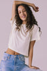 Woman wearing the Chaser Beau Starry White Tee featuring a boxy cropped silhouette and classic crew neckline