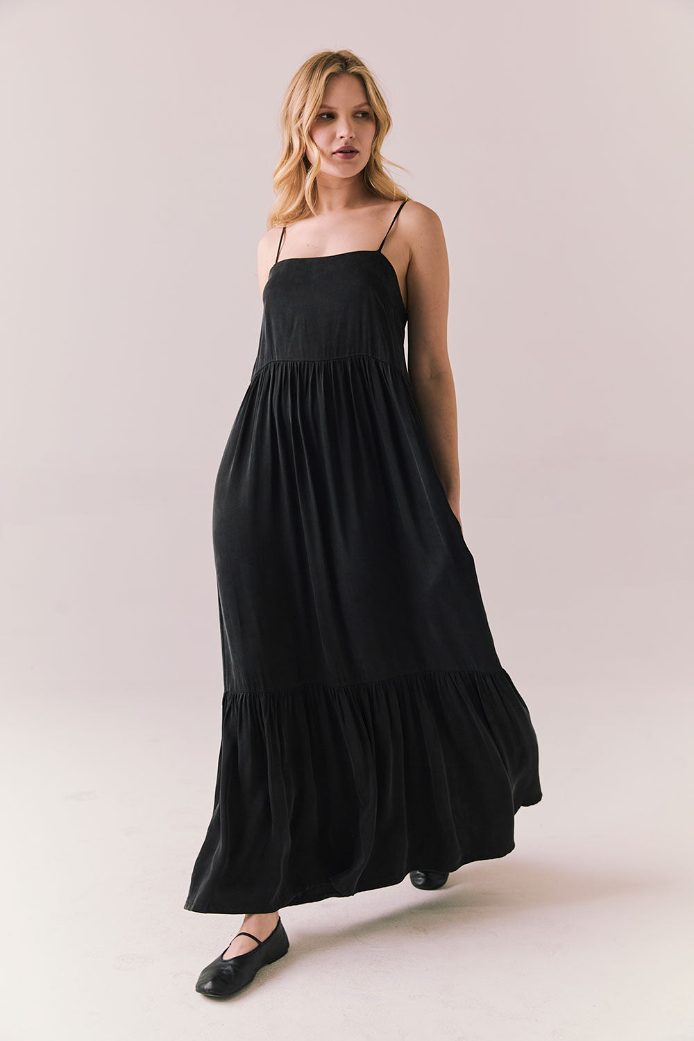 Side full body view of model in Berkeley Maxi Dress in true black