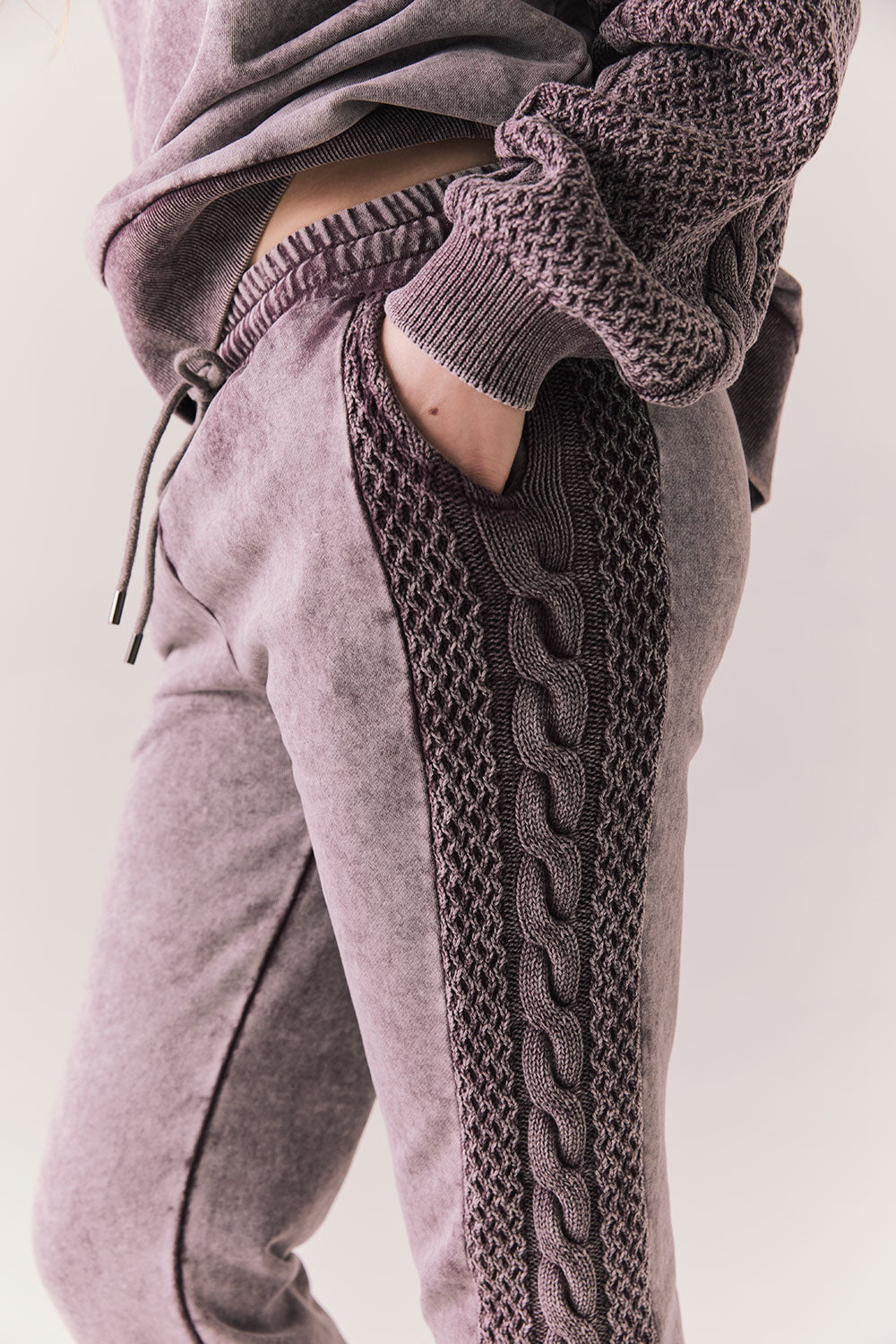 Side view of model wearing Bay Joggers in fig with fleece texture and pocket detail