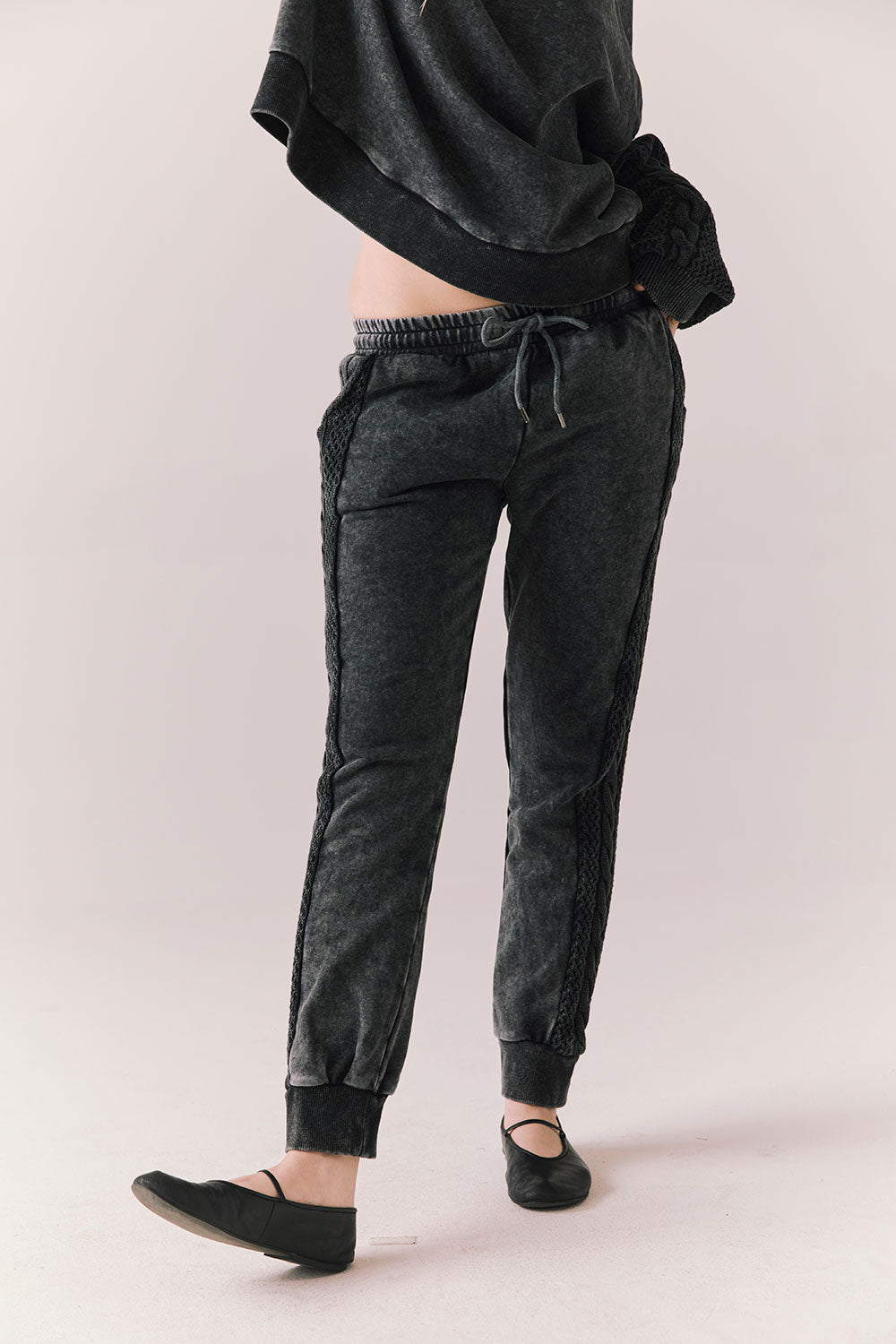 Front view of model wearing Bay Joggers in true black