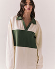 Woman wearing the color-blocked Chico Long Sleeve White and Green Rib Pullover on a white background