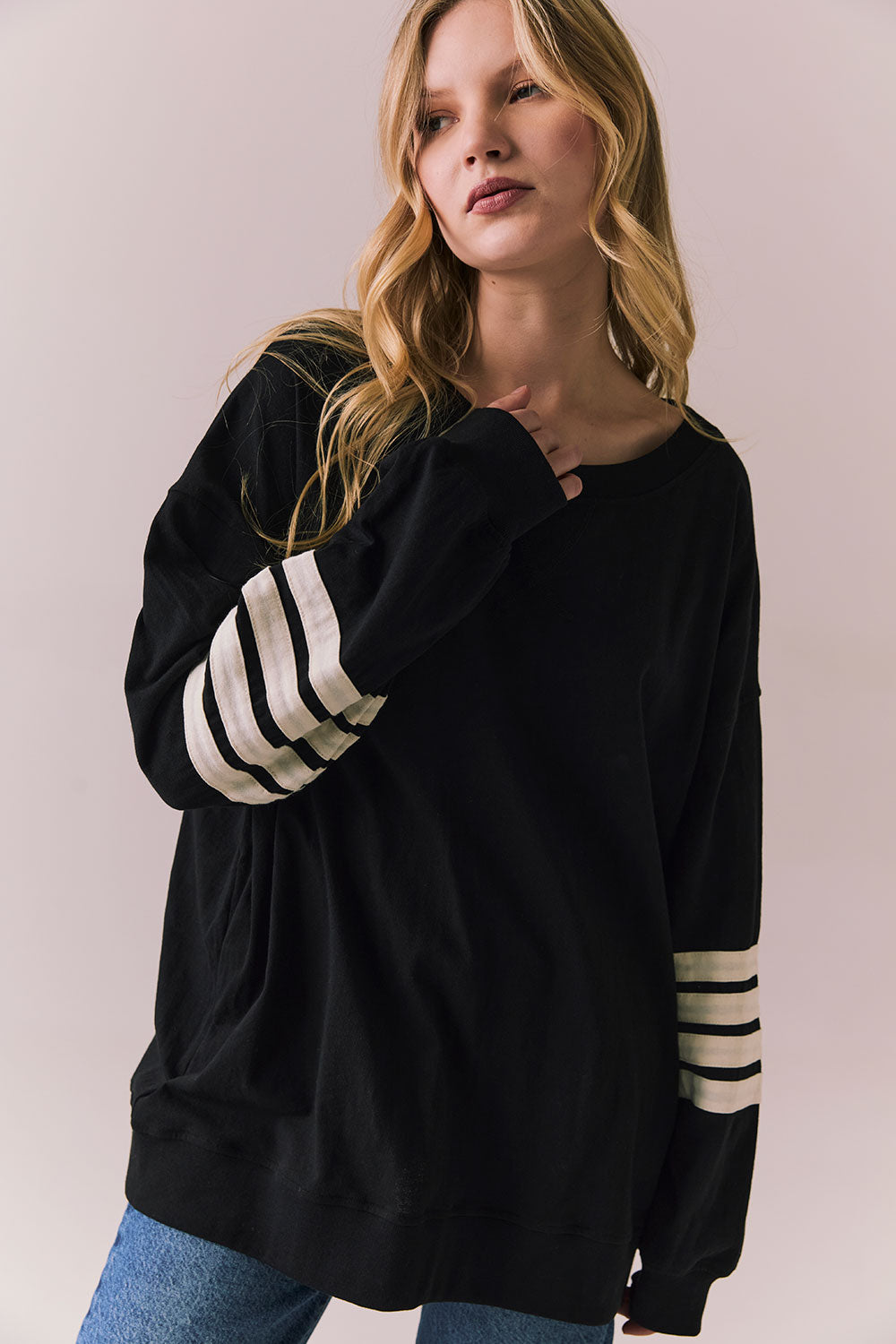 Front view of Pomona Long Sleeve in black and white with bold stripes and gigot sleeves against a plain background