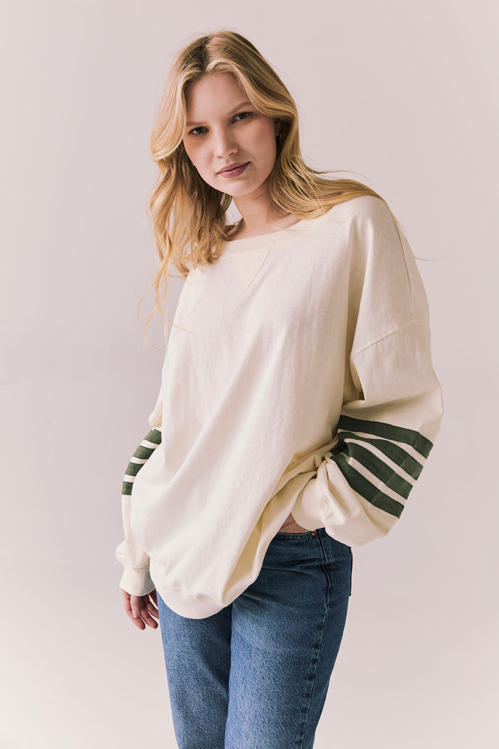 3/4 view of Pomona long sleeve in Starry White with Bronze Green stripes and gigot sleeves against a plain background
