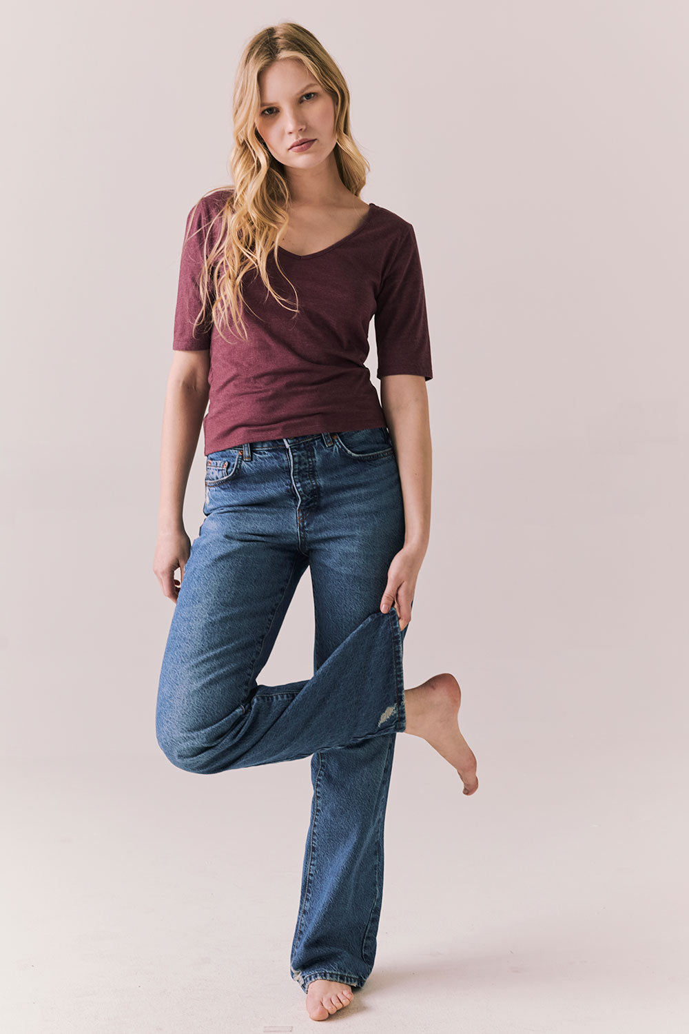 Full front view of Fresno tee in fig with scoop neck and fitted silhouette and denim on a plain background